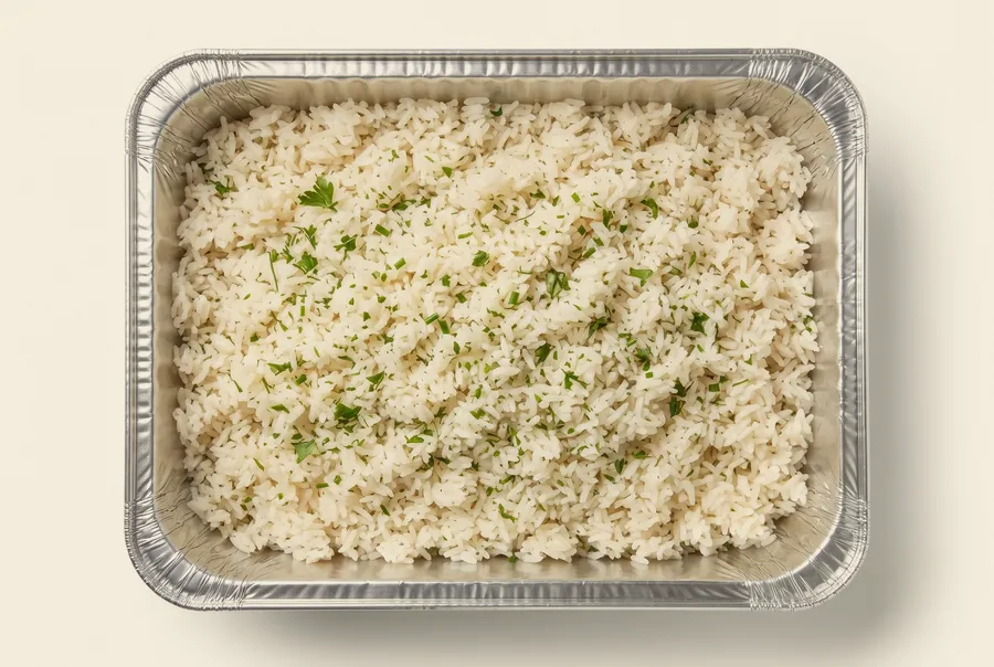 garlic parsley rice catering side — a tray of jasmine rice baked in stock with butter, garlic and flat-leaf parsley