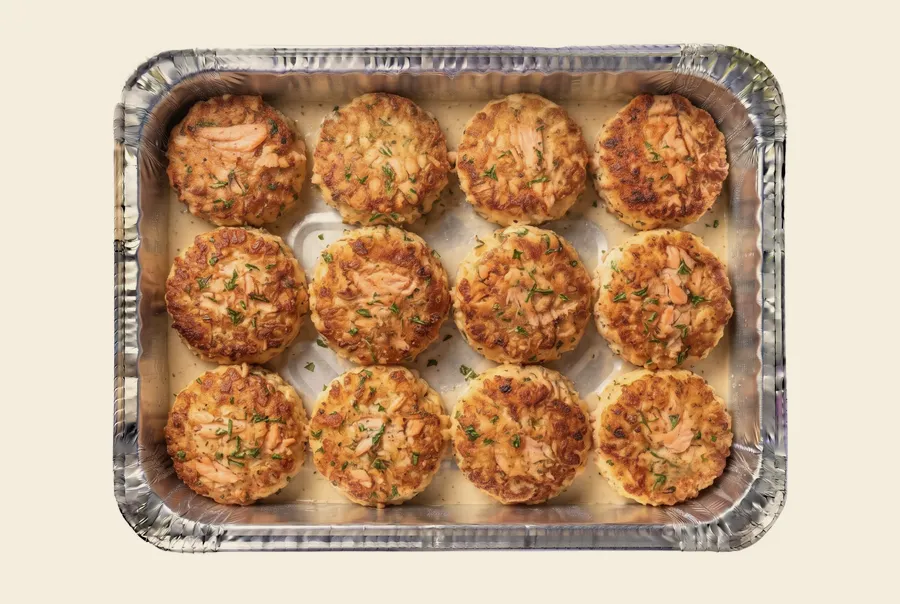 salmon cake catering tray — pan seared herbed salmon cakes with lemon tahini on the side, minneapolis catering