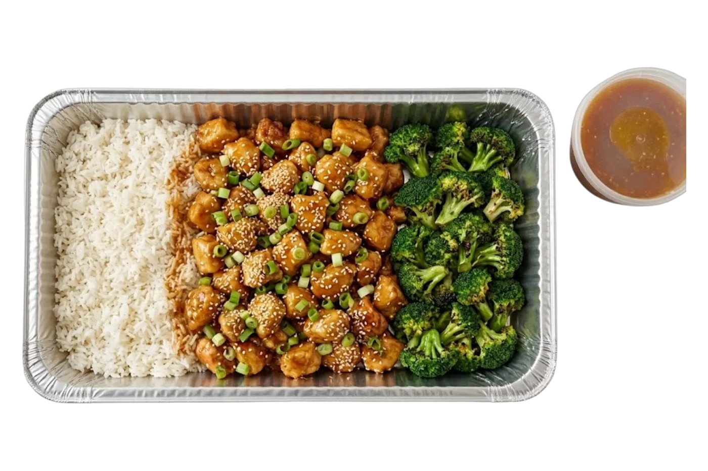 orange honey chicken catering tray — a foil pan of sesame-glazed chicken with jasmine rice and broccoli, sauce cup on the side, for twin cities corporate lunch catering