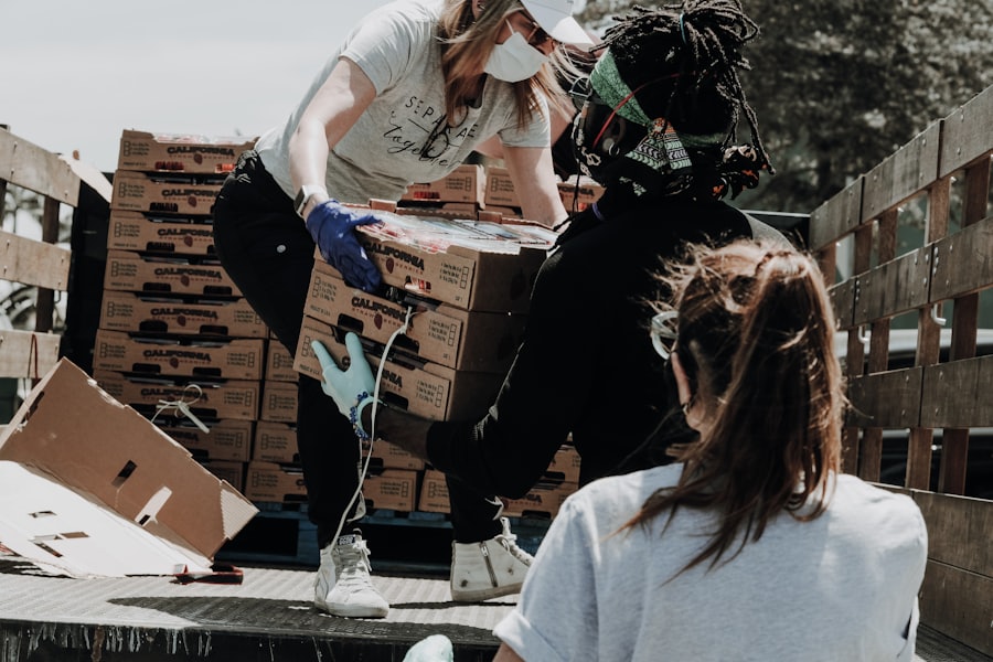 volunteers sorting food donations into boxes